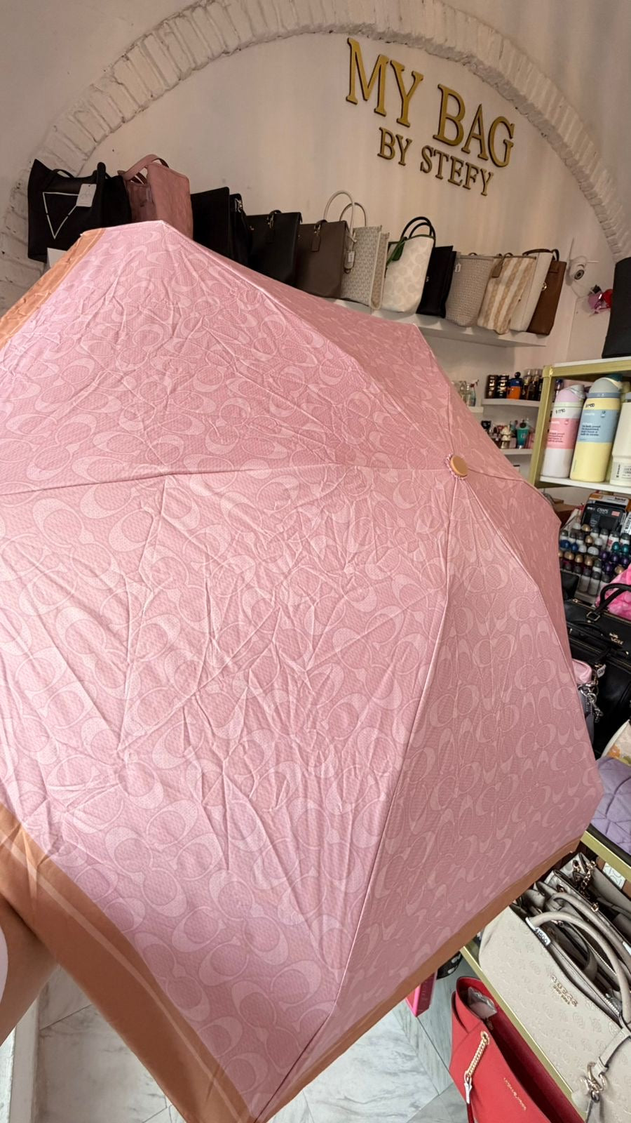 Sombrilla Rosa Coach ￼