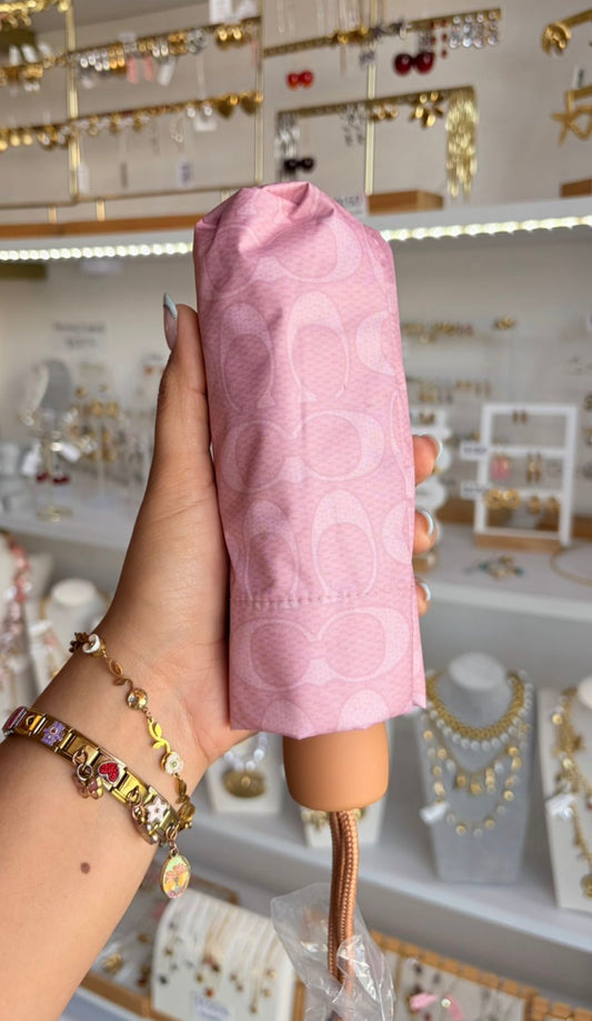 Sombrilla Rosa Coach ￼