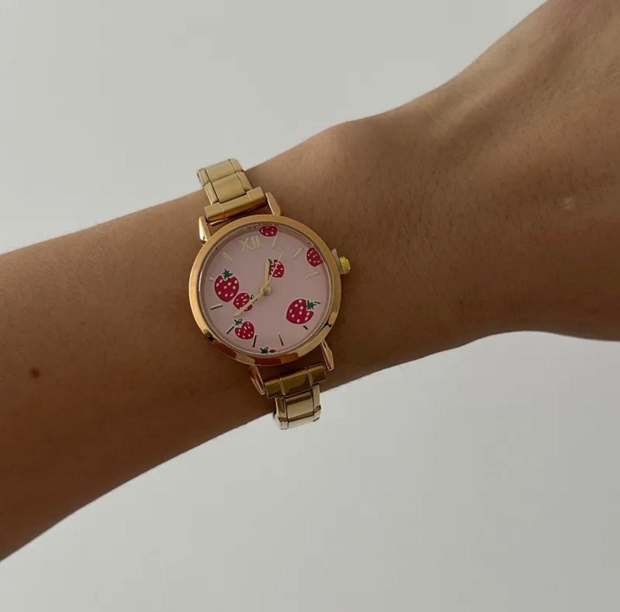 Reloj italiano dorado fresas