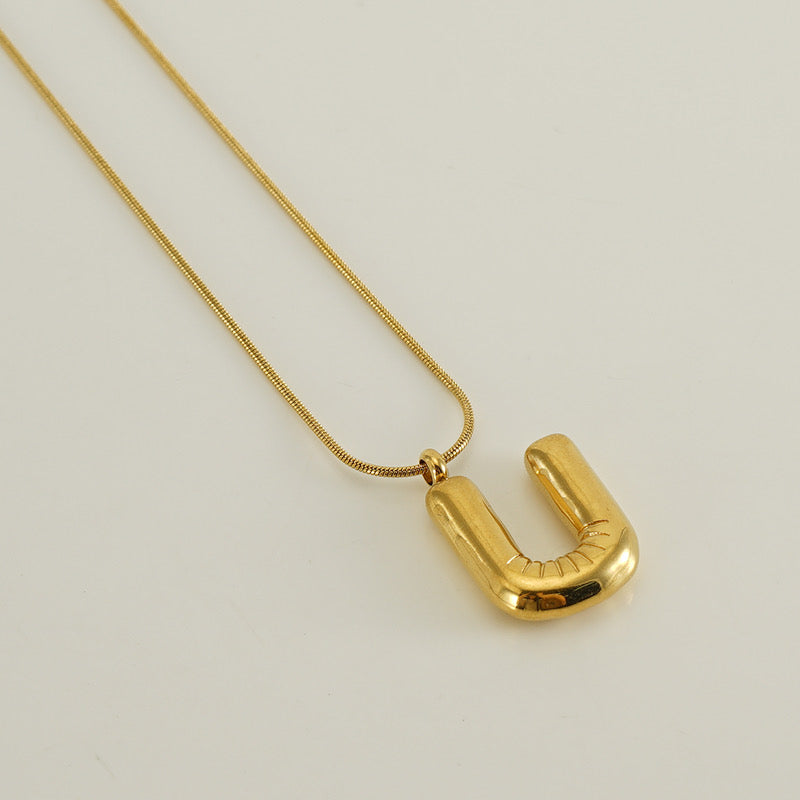 Collar Inicial Grande Dorado Acero